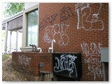 Brick Wall Graffiti Removal - Before